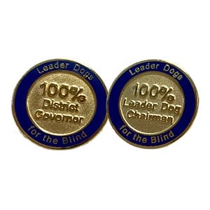 Circular pins that say Leader Dogs for the Blind around the edges and 100% District Governor or 100% Leader Dog Chairman