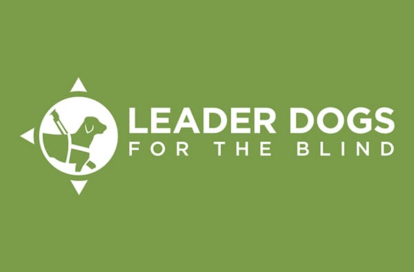 White Leader Dog logo on a green background