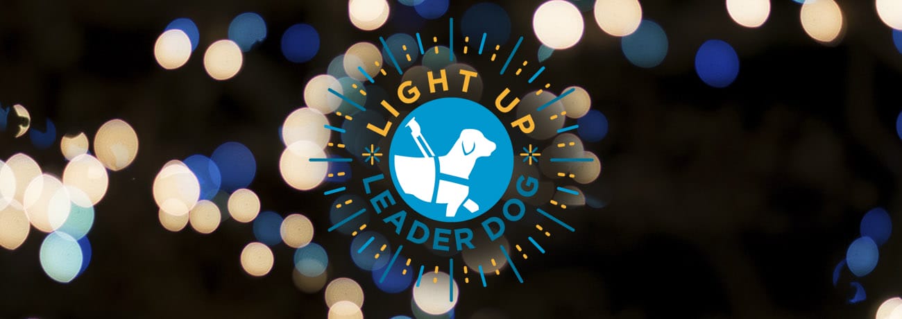 Light Up Leader Dog logo in blue and yellow with soft string lights image behind.